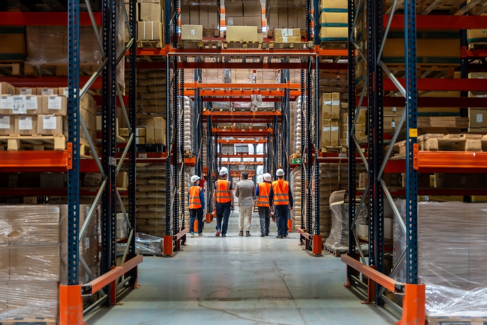 Group,Of,Diverse,Logistics,Workers,Wearing,Safety,Vests,And,Hard